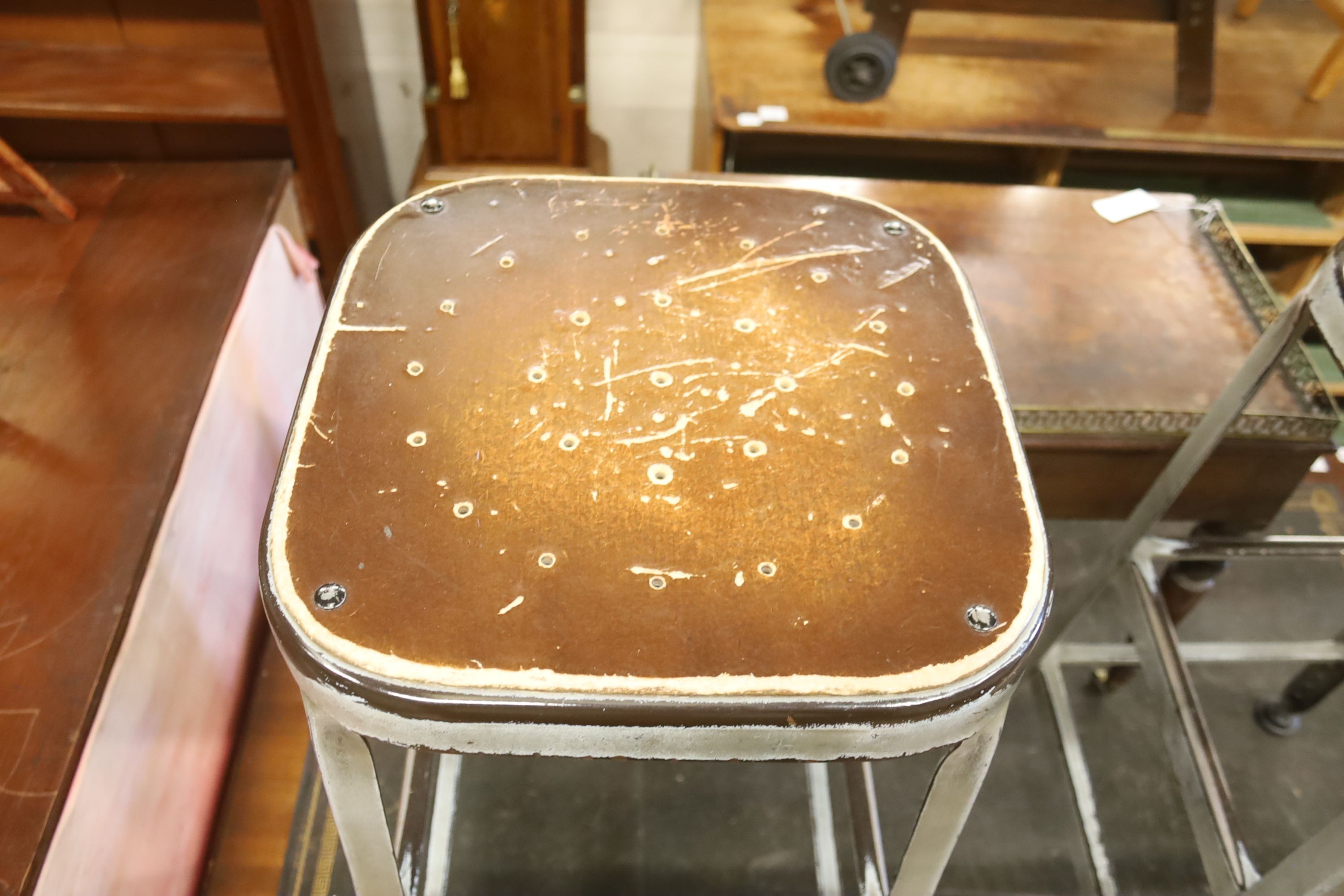 A pair of industrial style steel stools, height 74cm